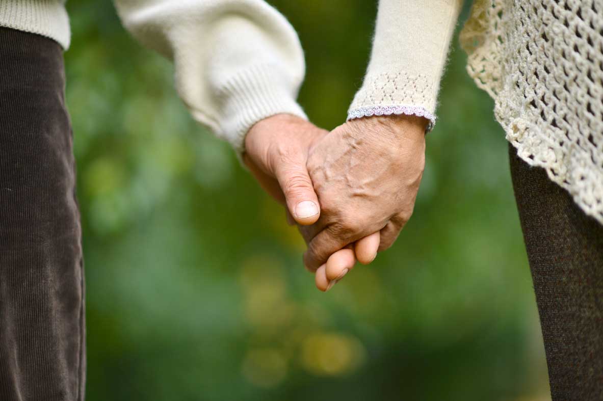 old couple holding hands