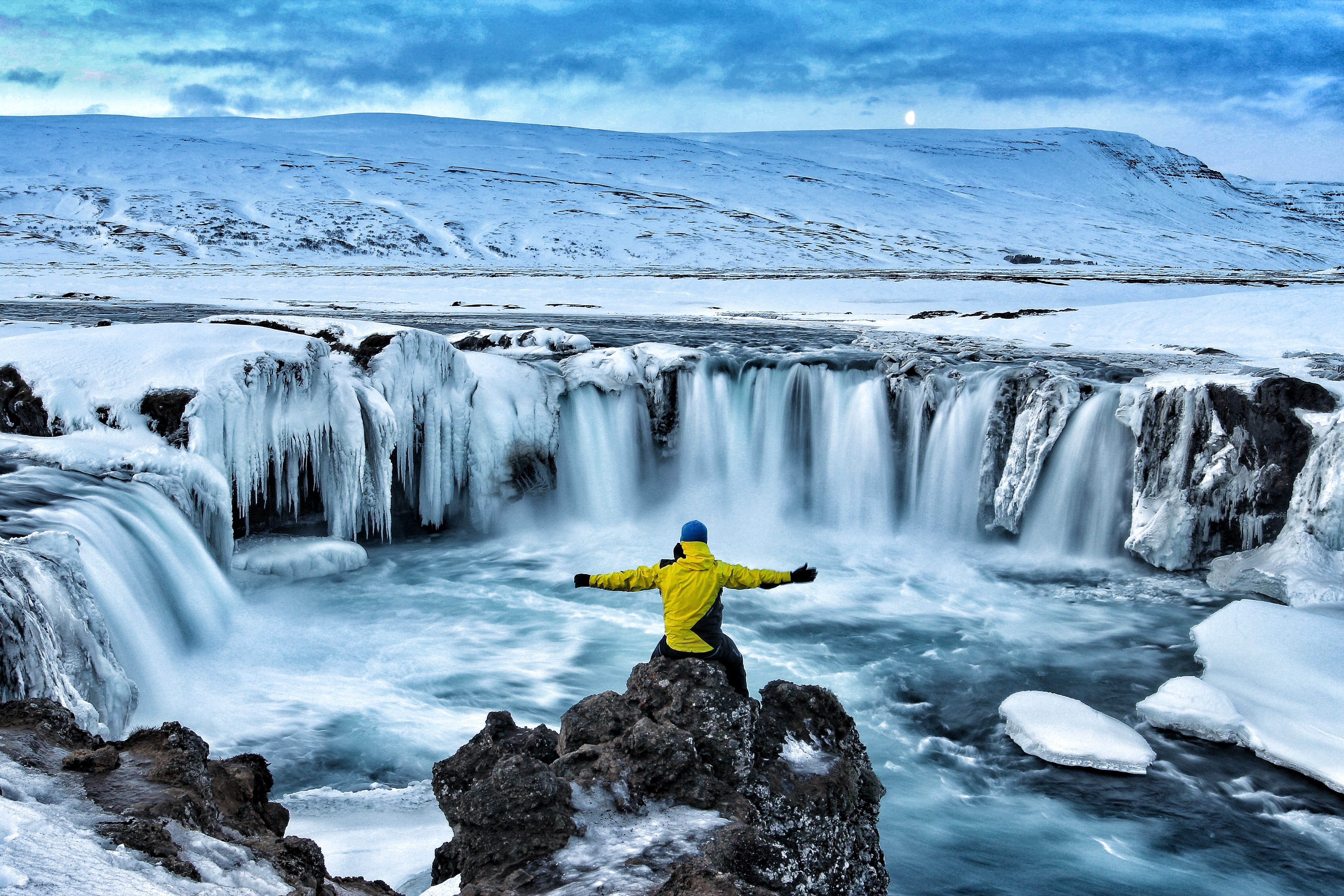 Hiker visiting Godafoss waterfall Iceland